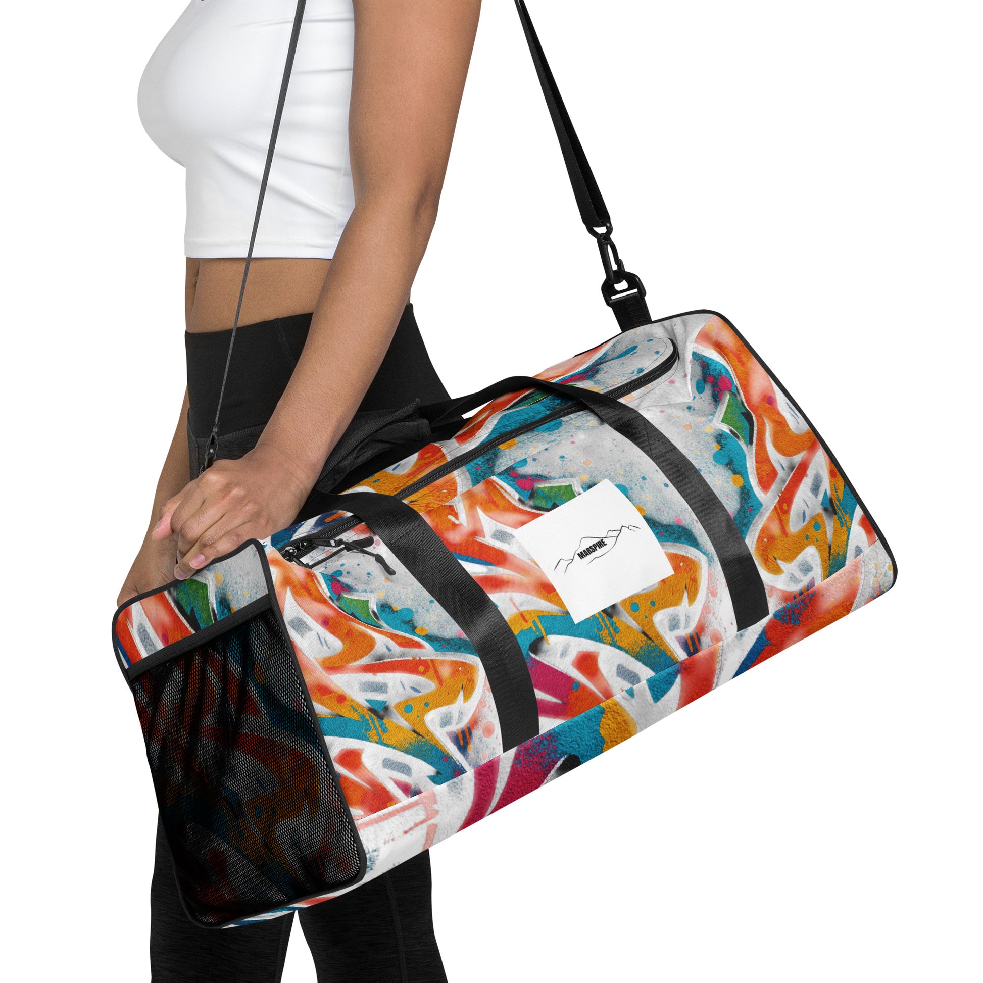 woman carrying a large duffle bag