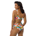woman smiling back and wearing retro high-waisted bikini