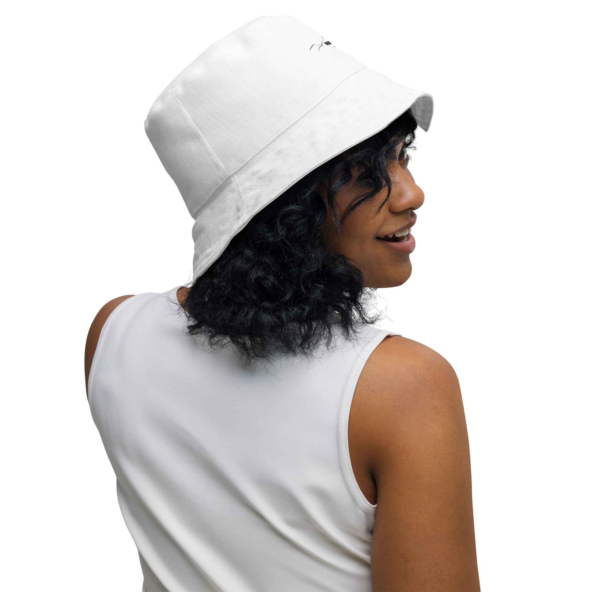 woman wearing reversible bucket hat - staring backward
