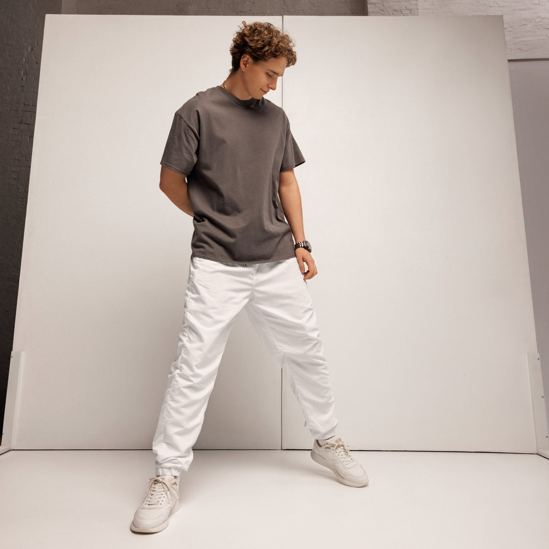 closeup person wearing white track pants