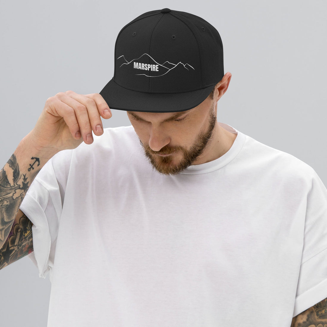 person wearing dark navy vintage snapback hat
