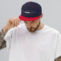 person wearing navy & red vintage snapback hat