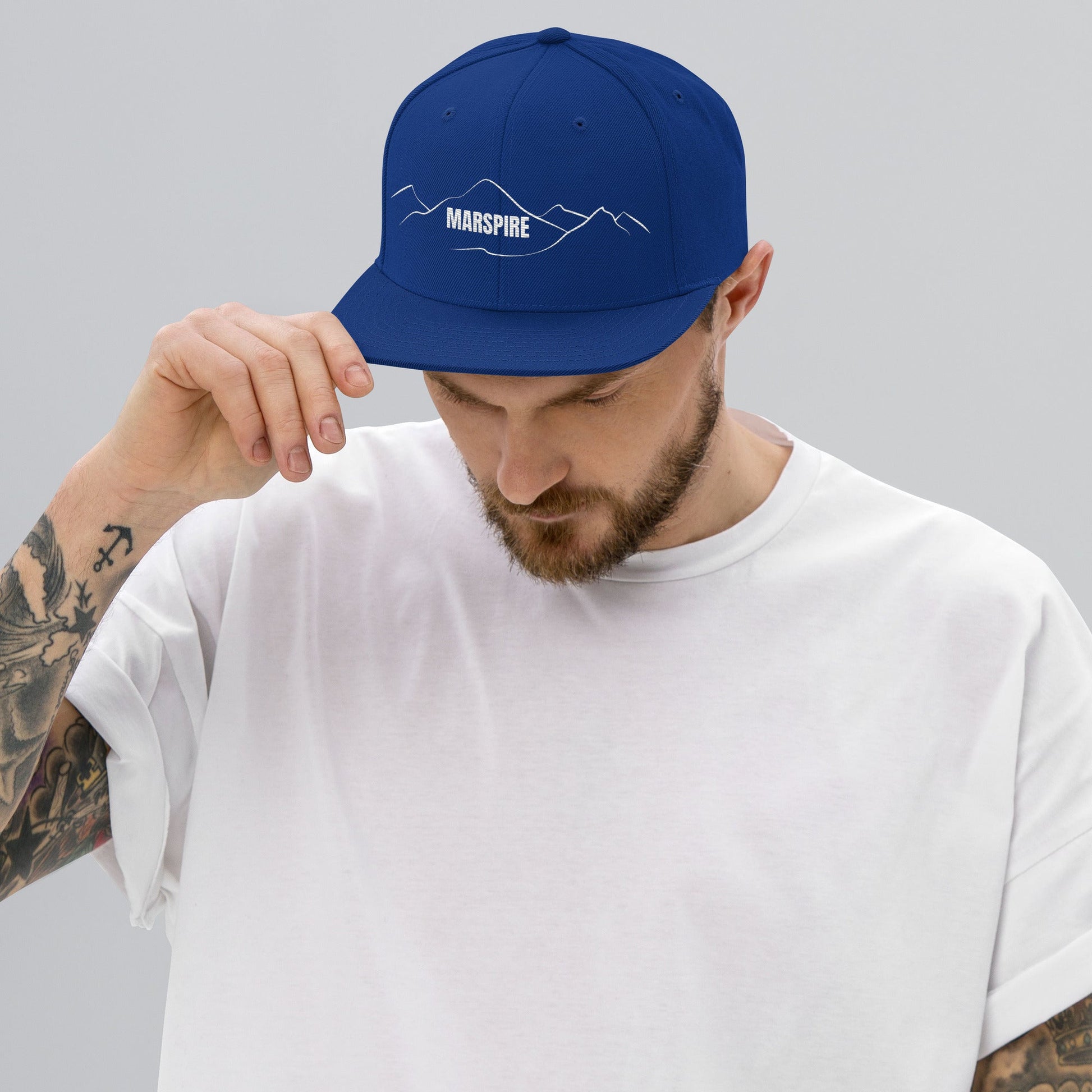 person wearing royal blue vintage snapback hat
