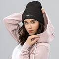 person wearing dark grey beanie hat
