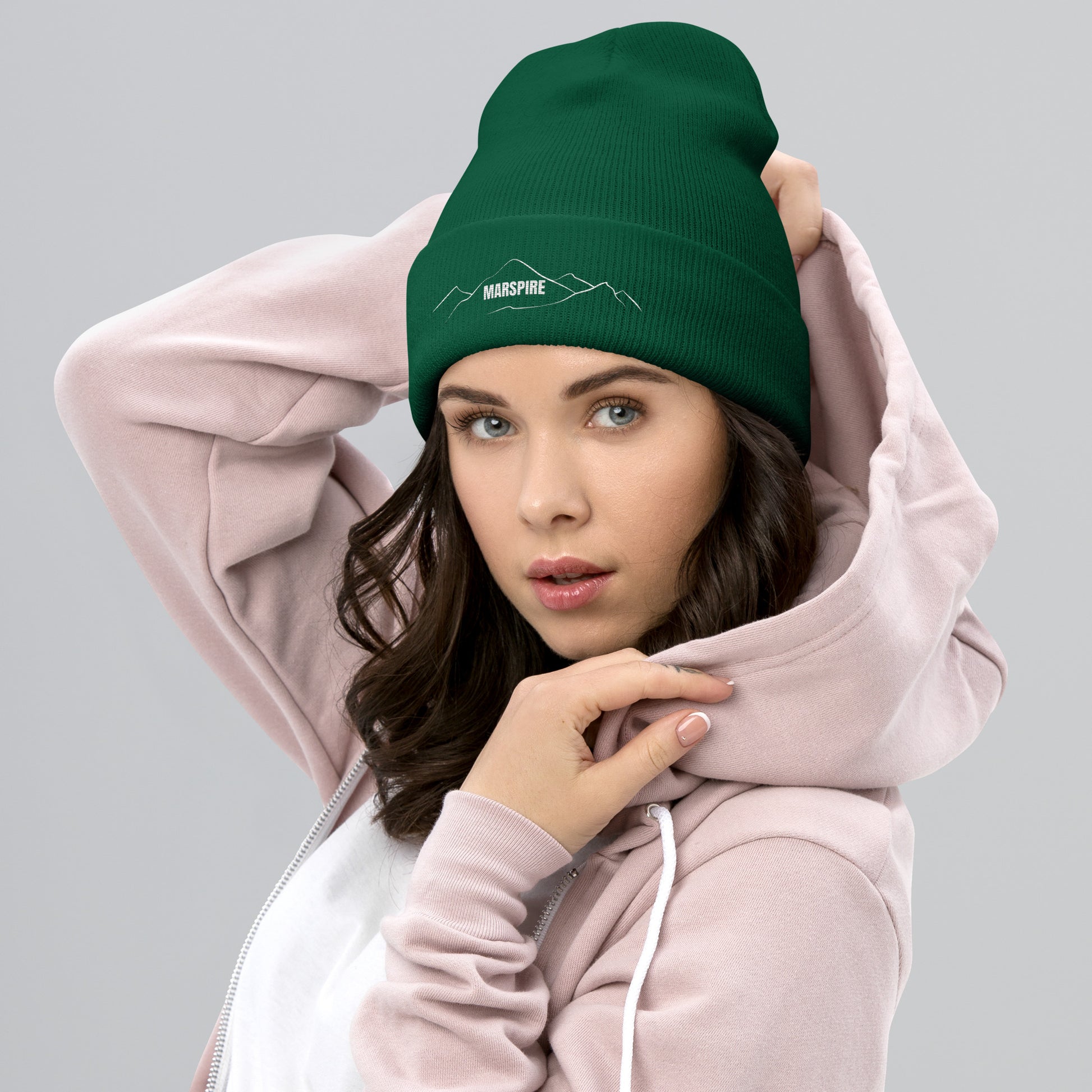 person wearing spruce beanie hat