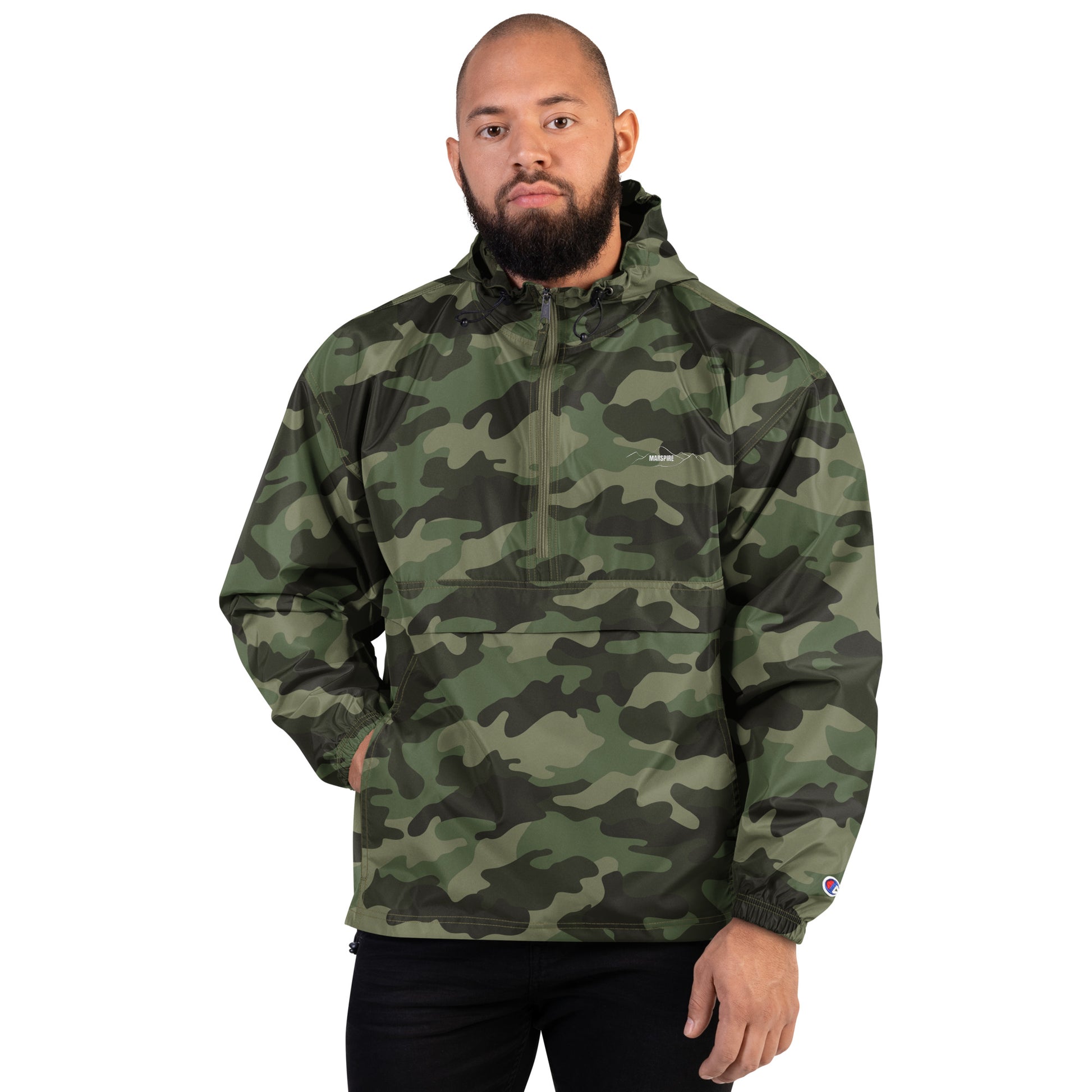 person wearing olive green camo champion packable jacket