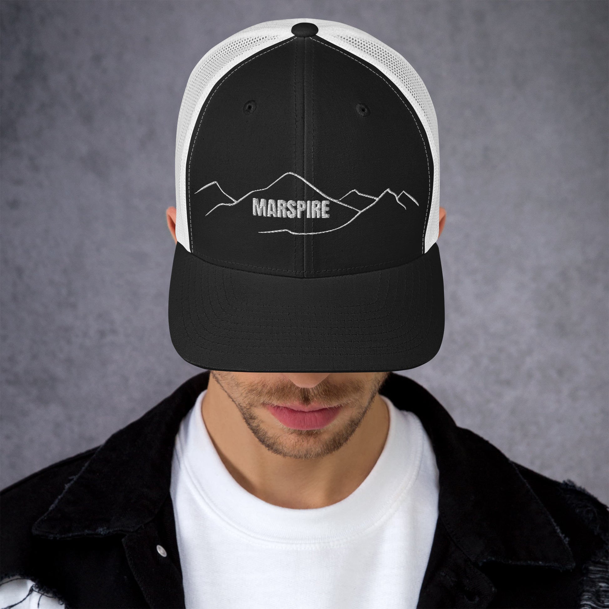 front view of black & white mesh trucker cap