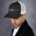 left view of black & white mesh trucker cap