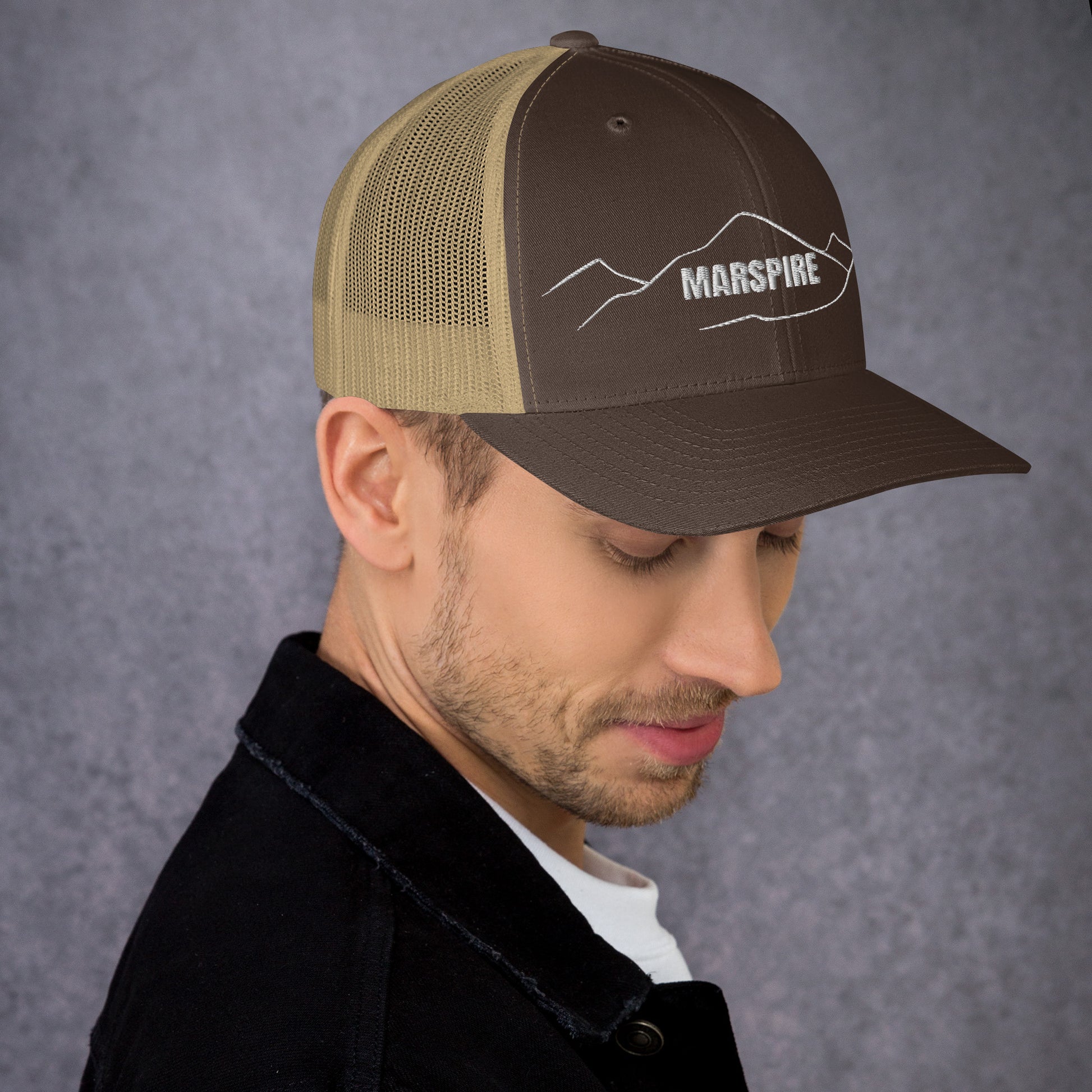 right view of dark heather grey mesh trucker cap