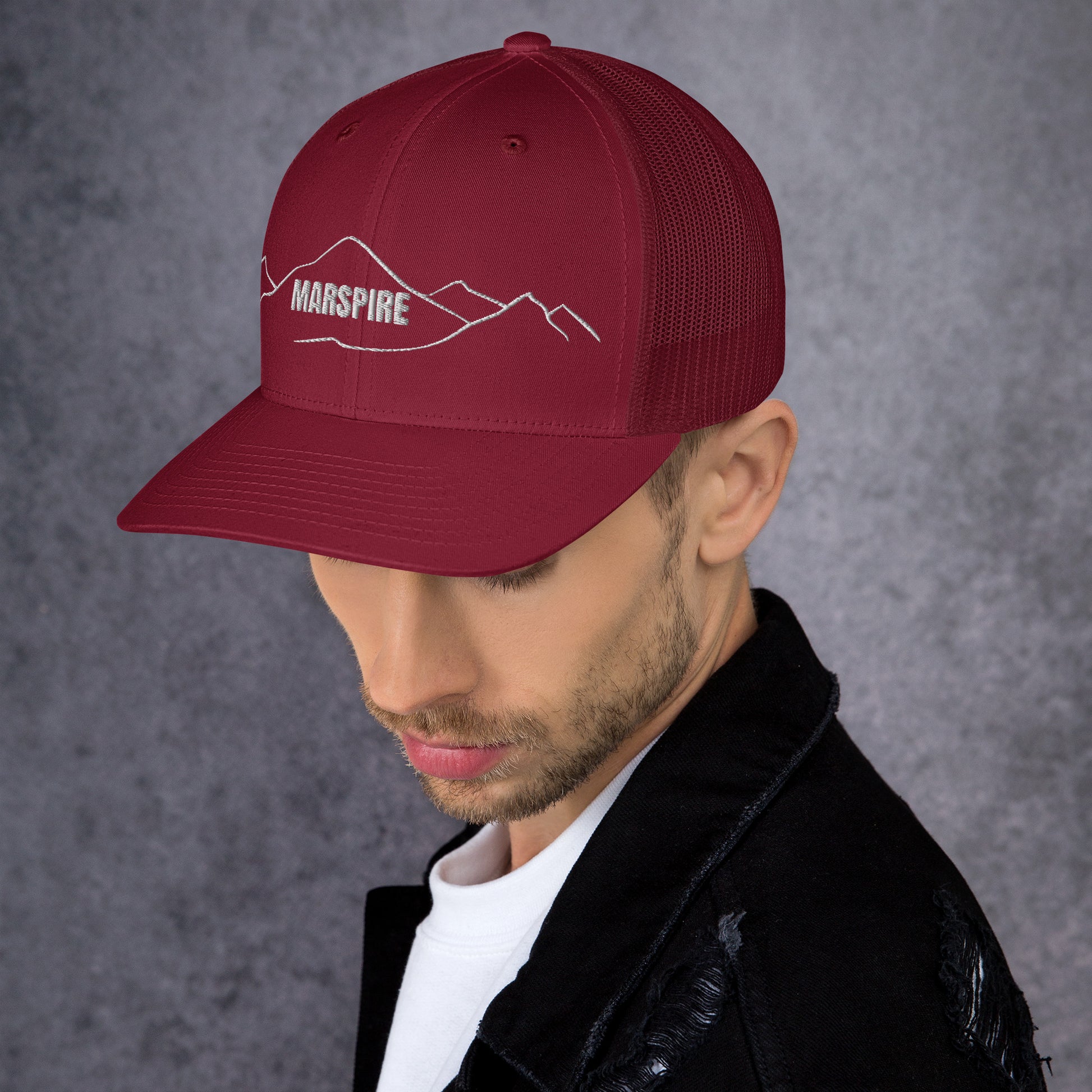 left view of cranberry mesh trucker cap