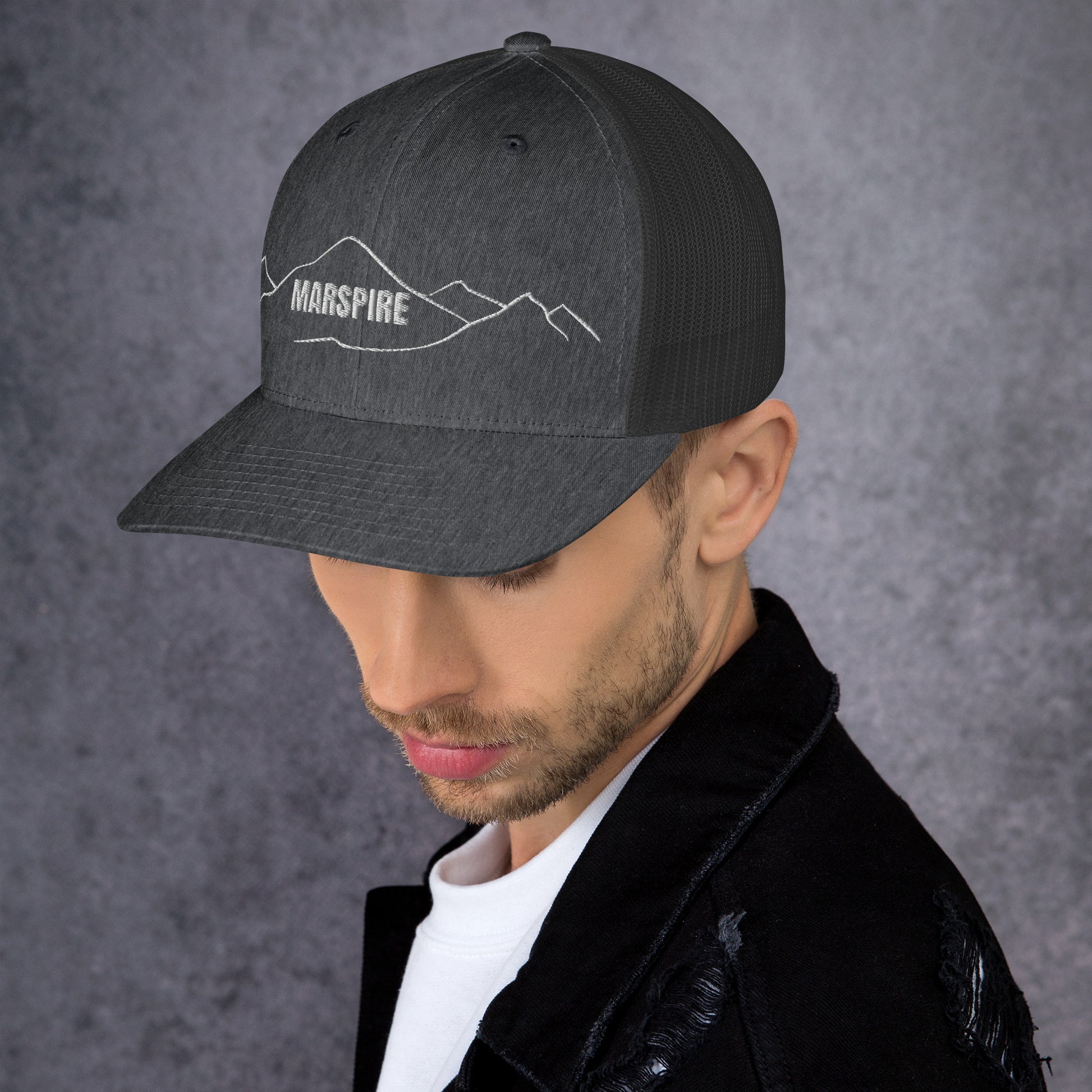 left view of dark heather grey mesh trucker cap