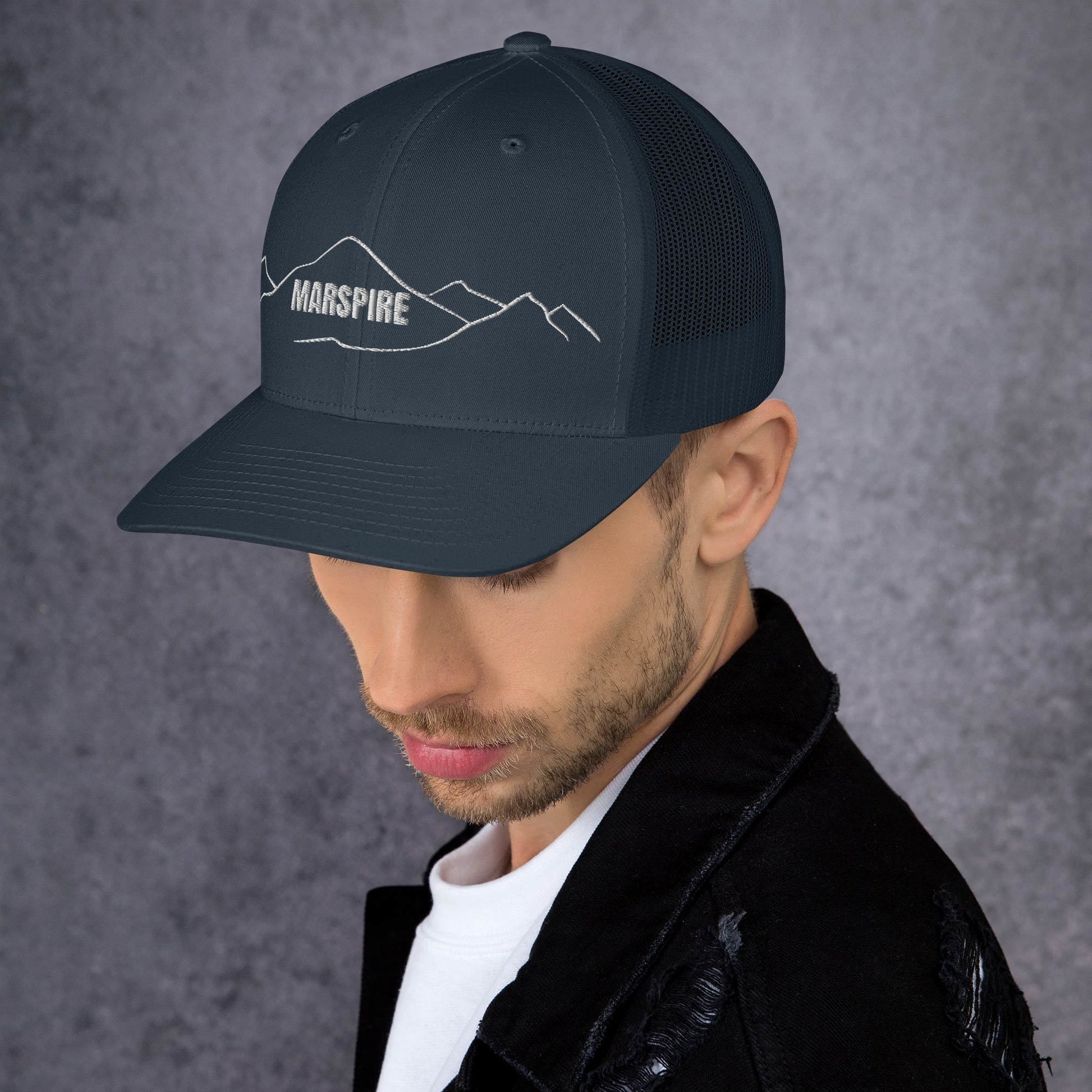 left view of navy mesh trucker cap
