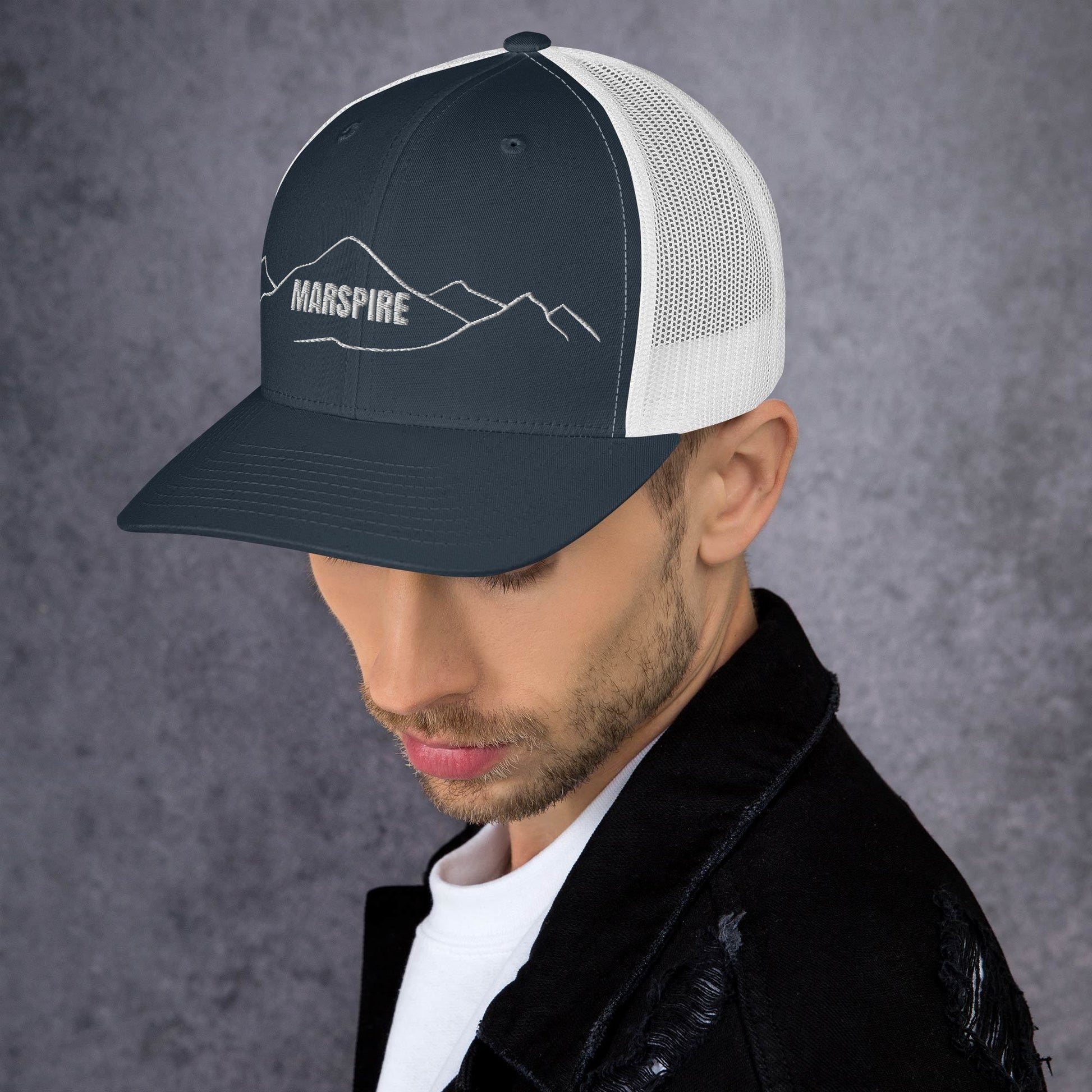 left view of navy & white mesh trucker cap