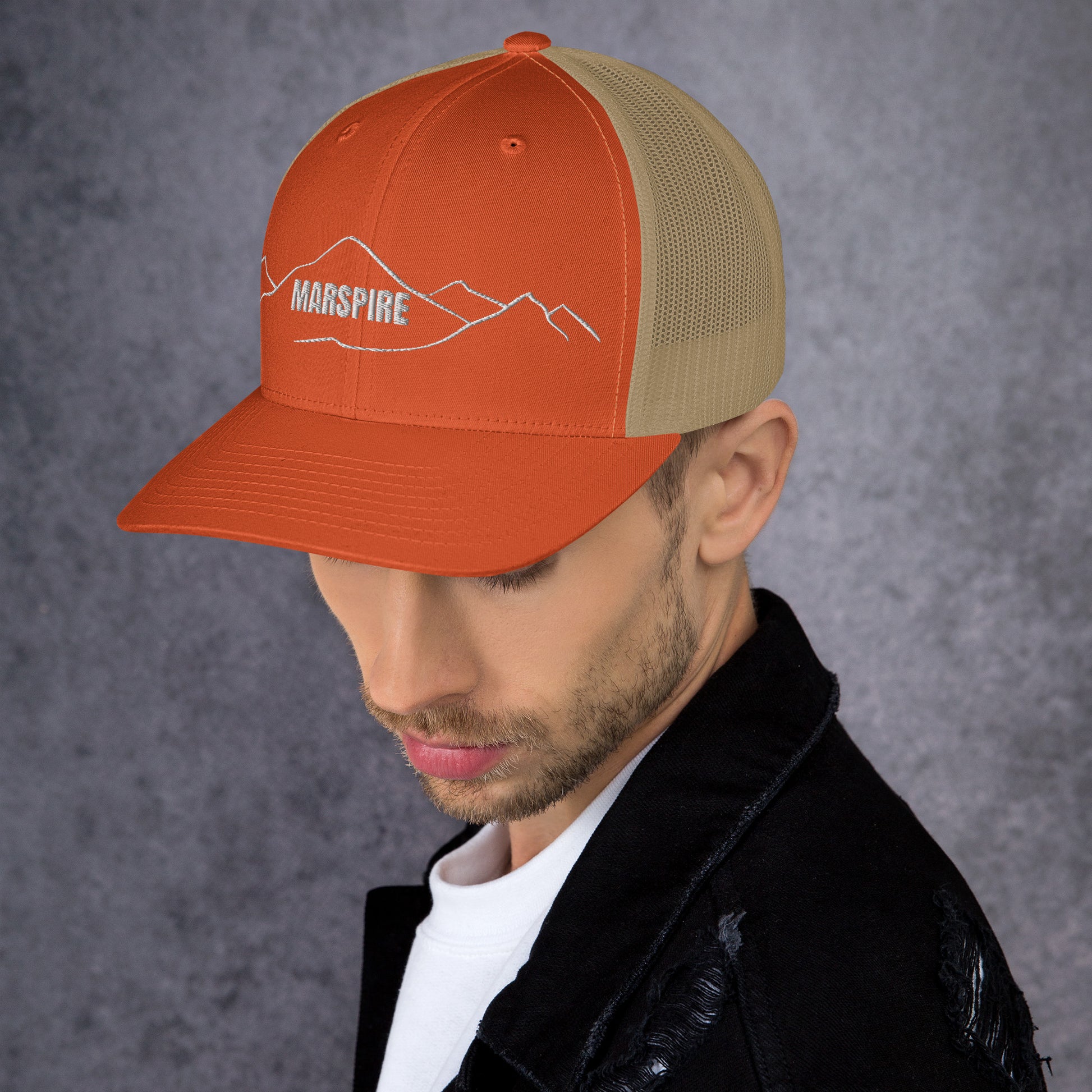 left view of rustic orange & khaki mesh trucker cap