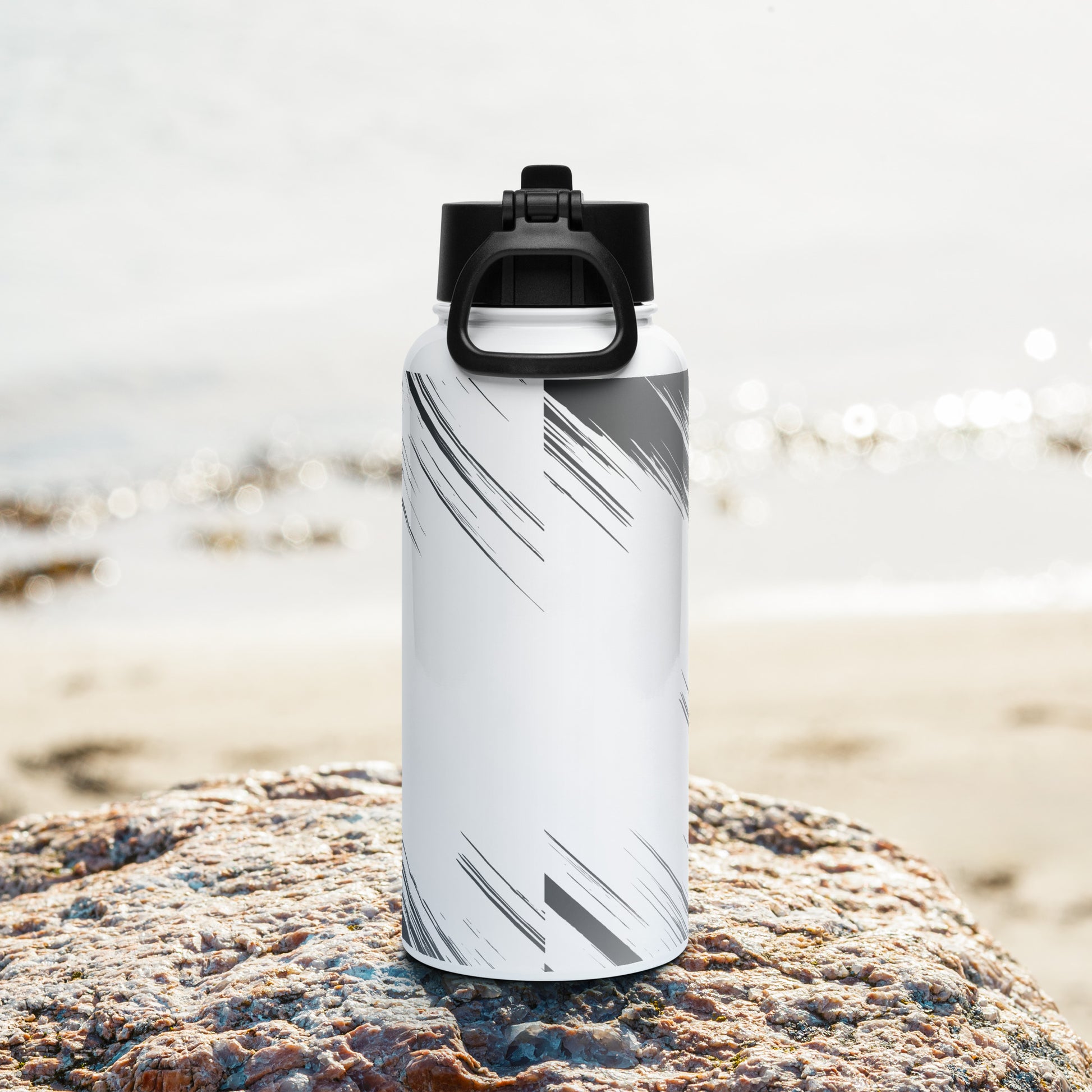 rear view of stainless steel water bottle with straw - closed lid