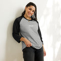 person wearing heather grey & black raglan tee shirts