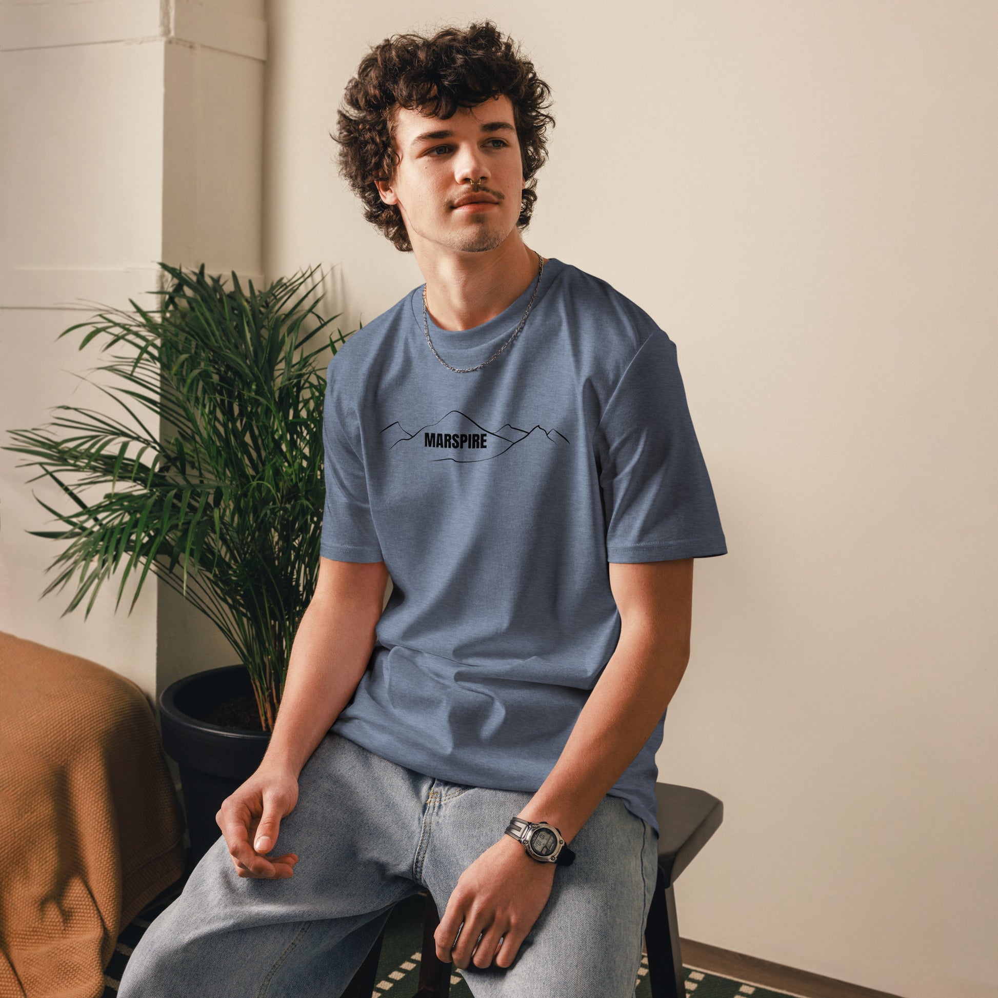 person wearing dark heather blue cotton t-shirt