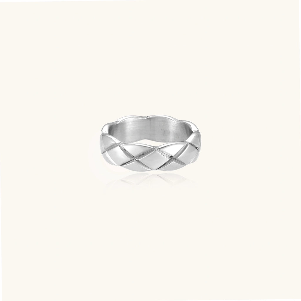 Braided stainless steel band ring with geometric interwoven strands in brushed silver finish on white background