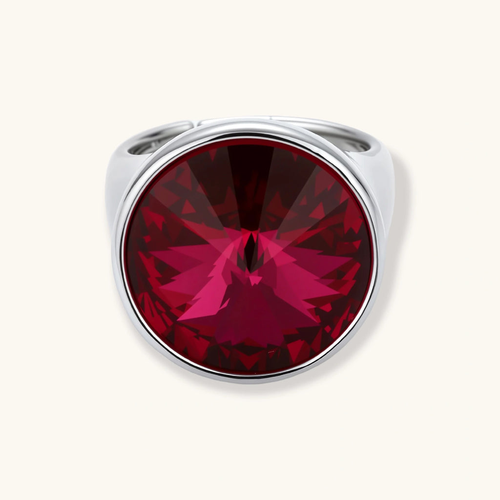 Large burgundy zirconia stone in sleek palladium-plated bezel setting on white background, showing brilliant faceted cut.