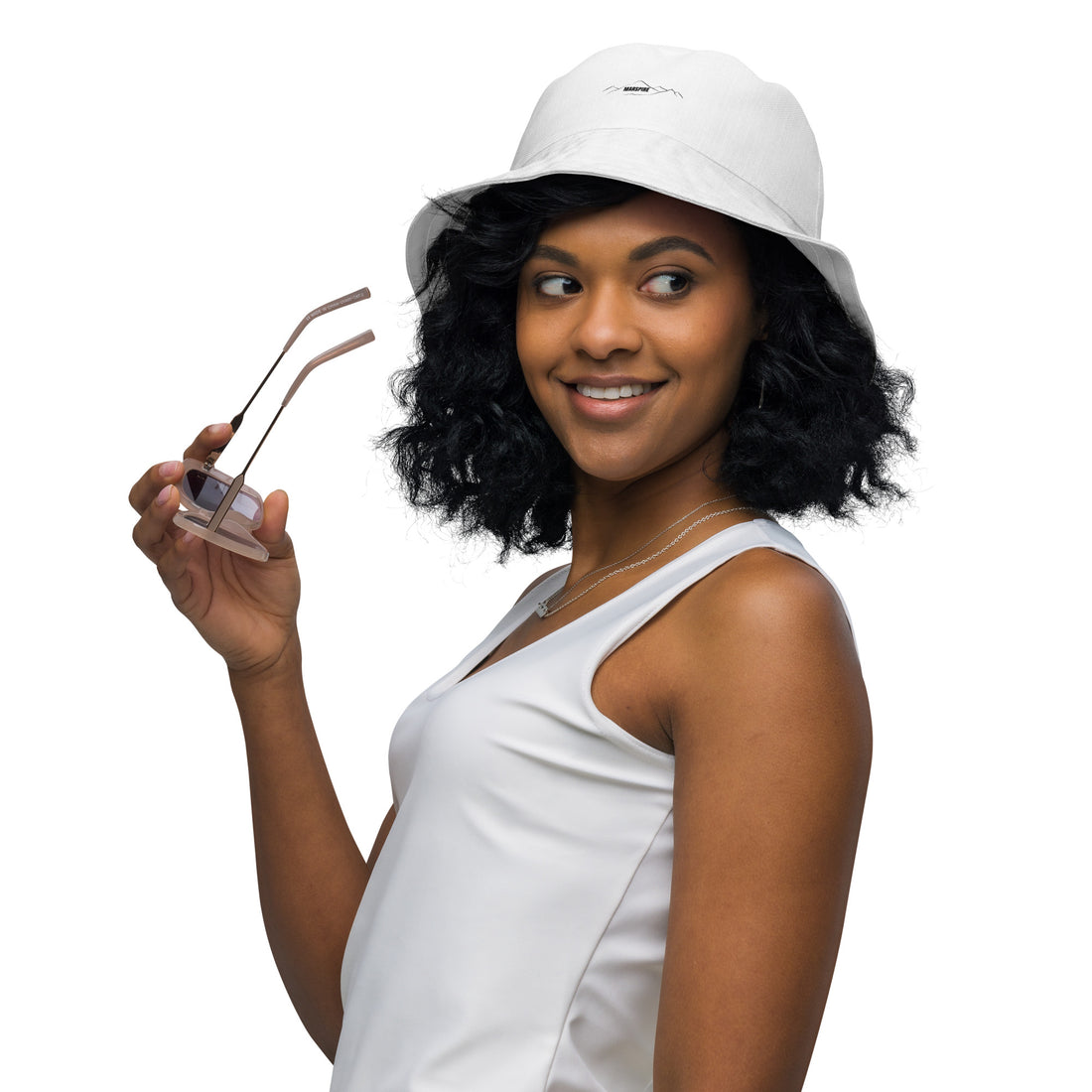 woman wearing reversible bucket hat